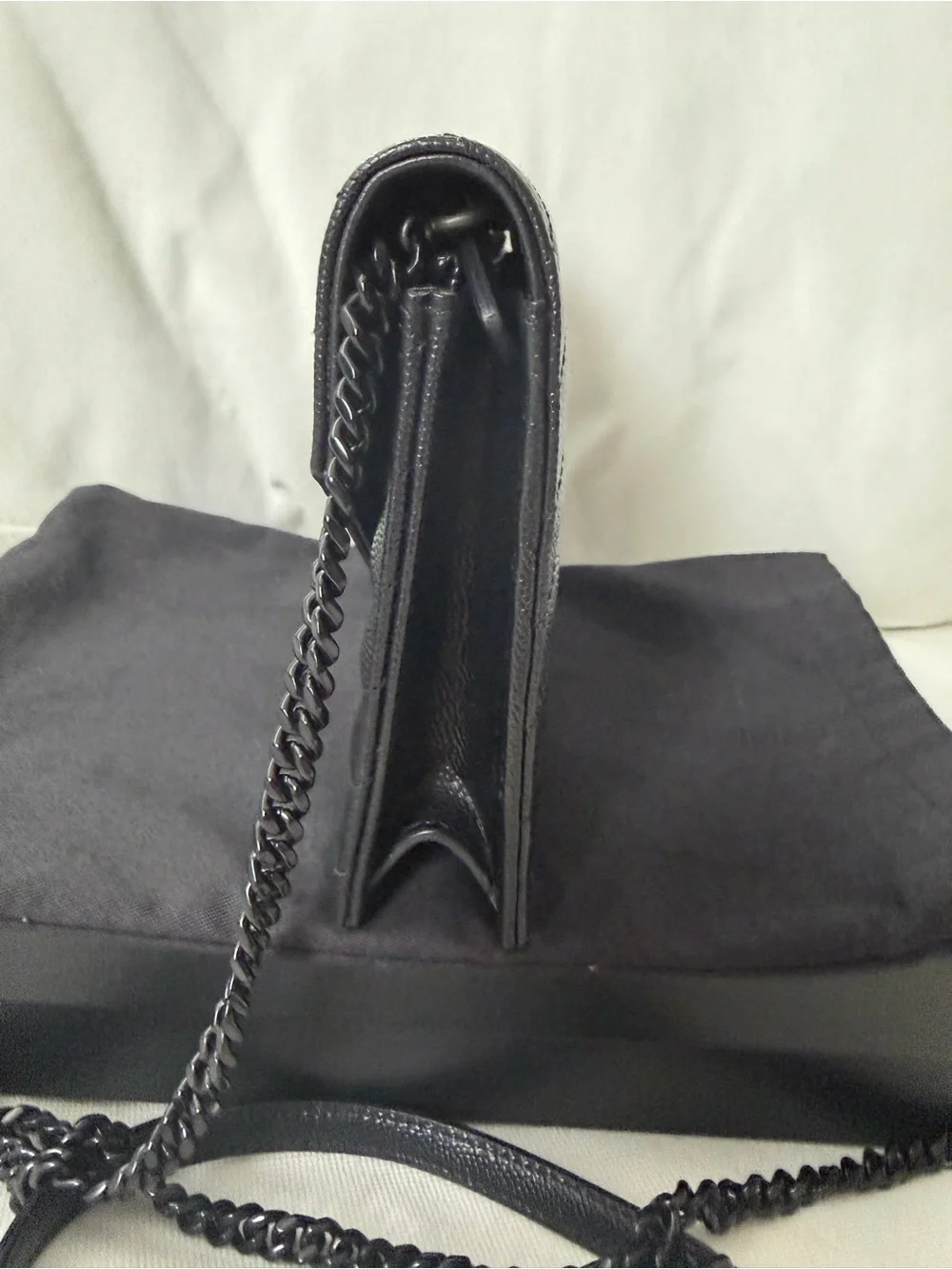 Saint Laurent Envelope Chain Wallet black monochrome design .